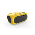 M24 micro mini portable LED projector in gold or white colour on a dark surface