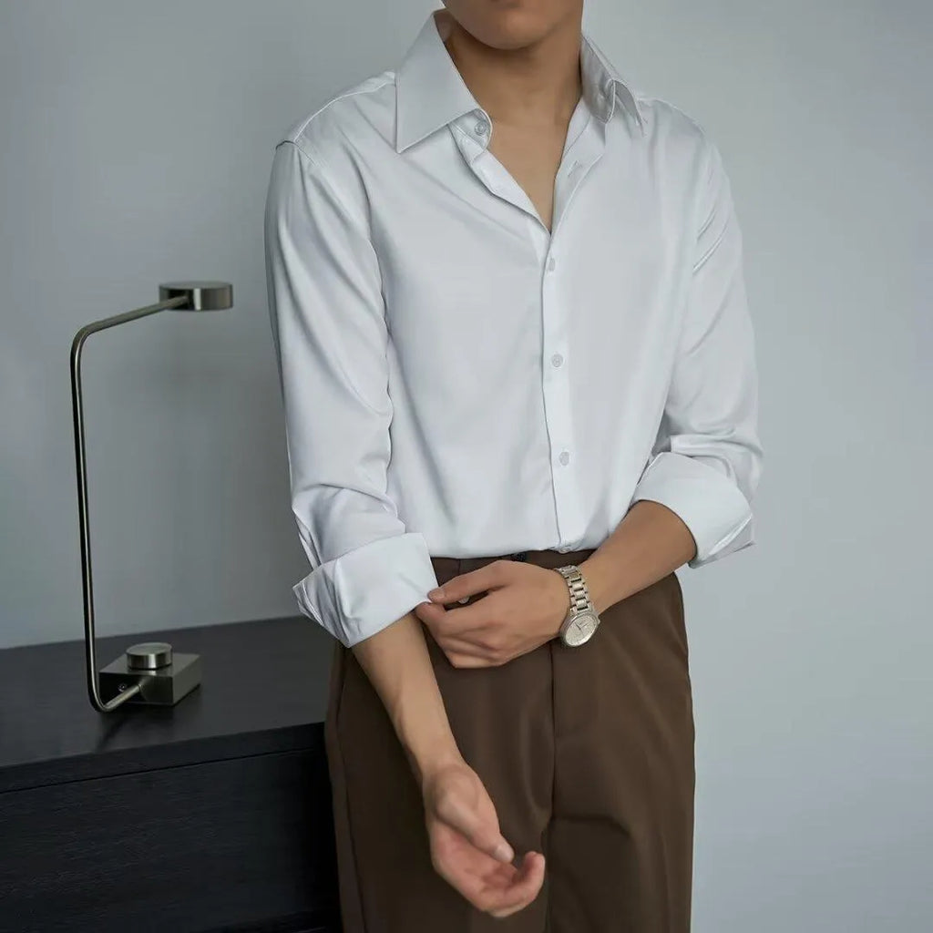 Man wearing a black long sleeve Korean-style cardigan shirt with a loose fit.