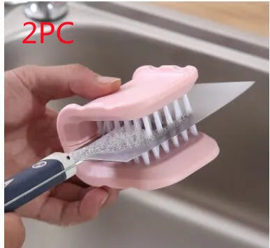 U-shaped knife and cutlery cleaner brush with ABS bristles in blue, resting on a kitchen counter
