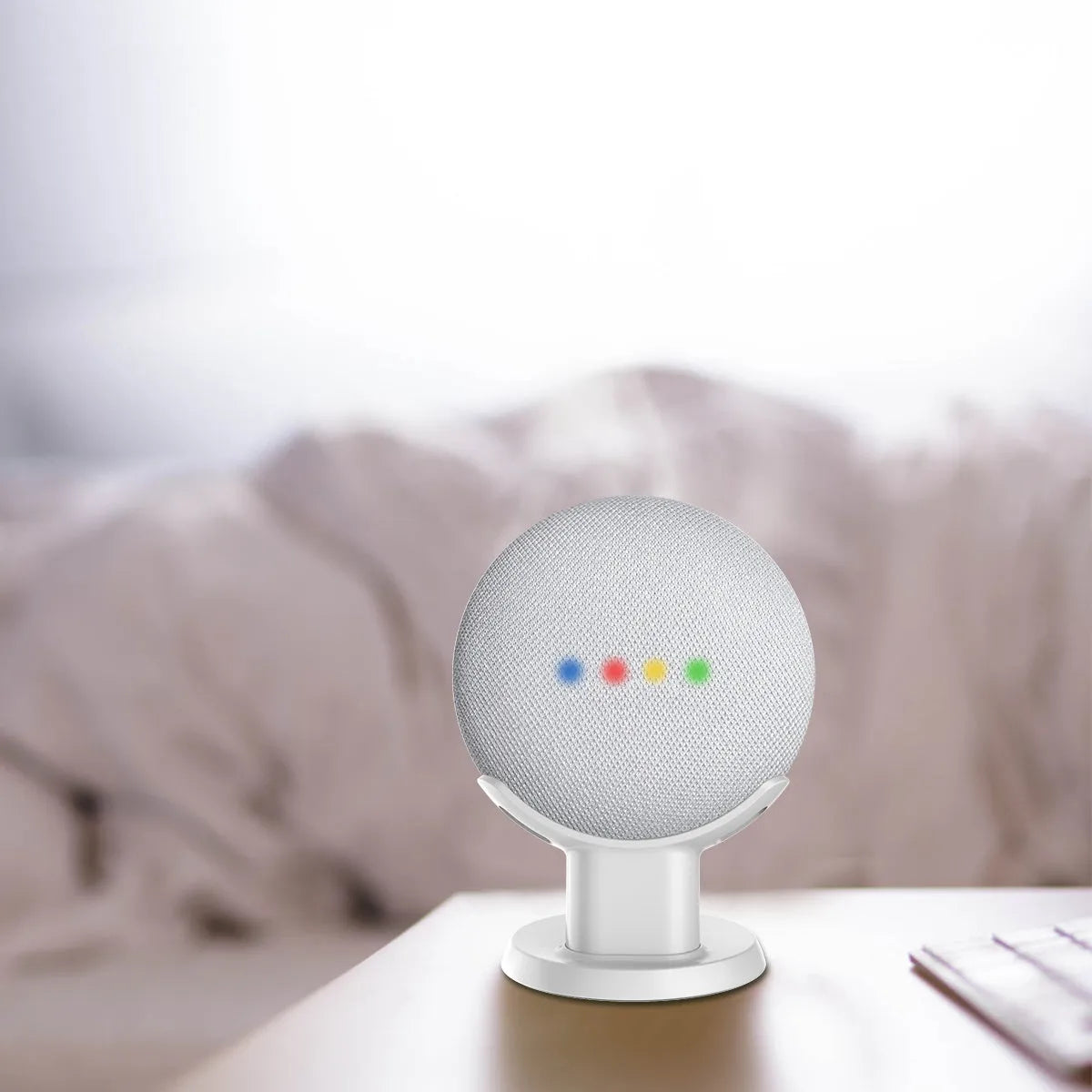 Compact plastic table holder stand for Google Home Mini in black colour with cable slot visible