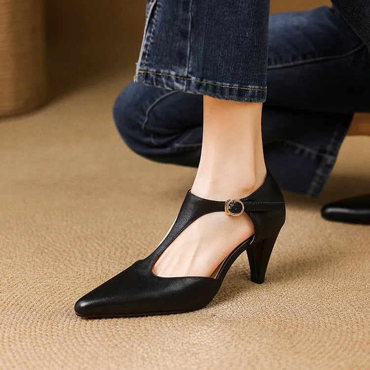 Women's brown retro T-bar strap sandals with a closed round toe and a chunky leather heel.