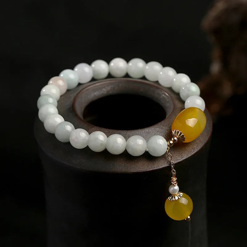 Women's bracelet with red agate round beads 7.5mm and hanging tassel in 14K gilded finish