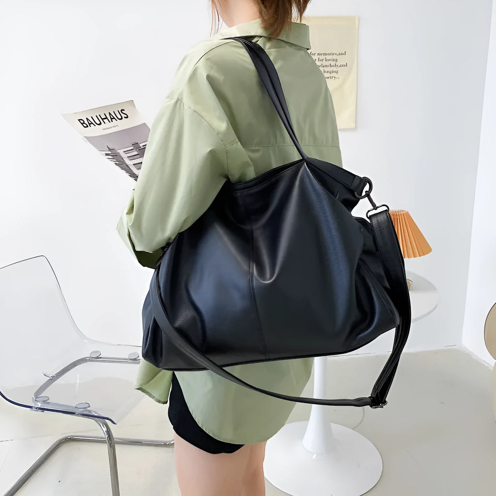 Large soft surface messenger bag with zip opening and adjustable shoulder strap in four colour options