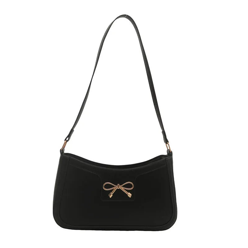 Portable PU shoulder bag in western baguette style with bow detail, 24x14x5 cm, available in multiple colours