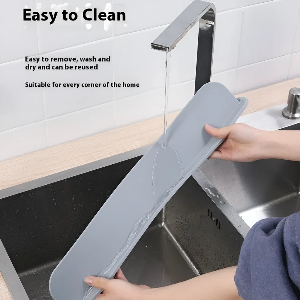 Grey silicone kitchen sink water blocking plate showing dimensions on a countertop.