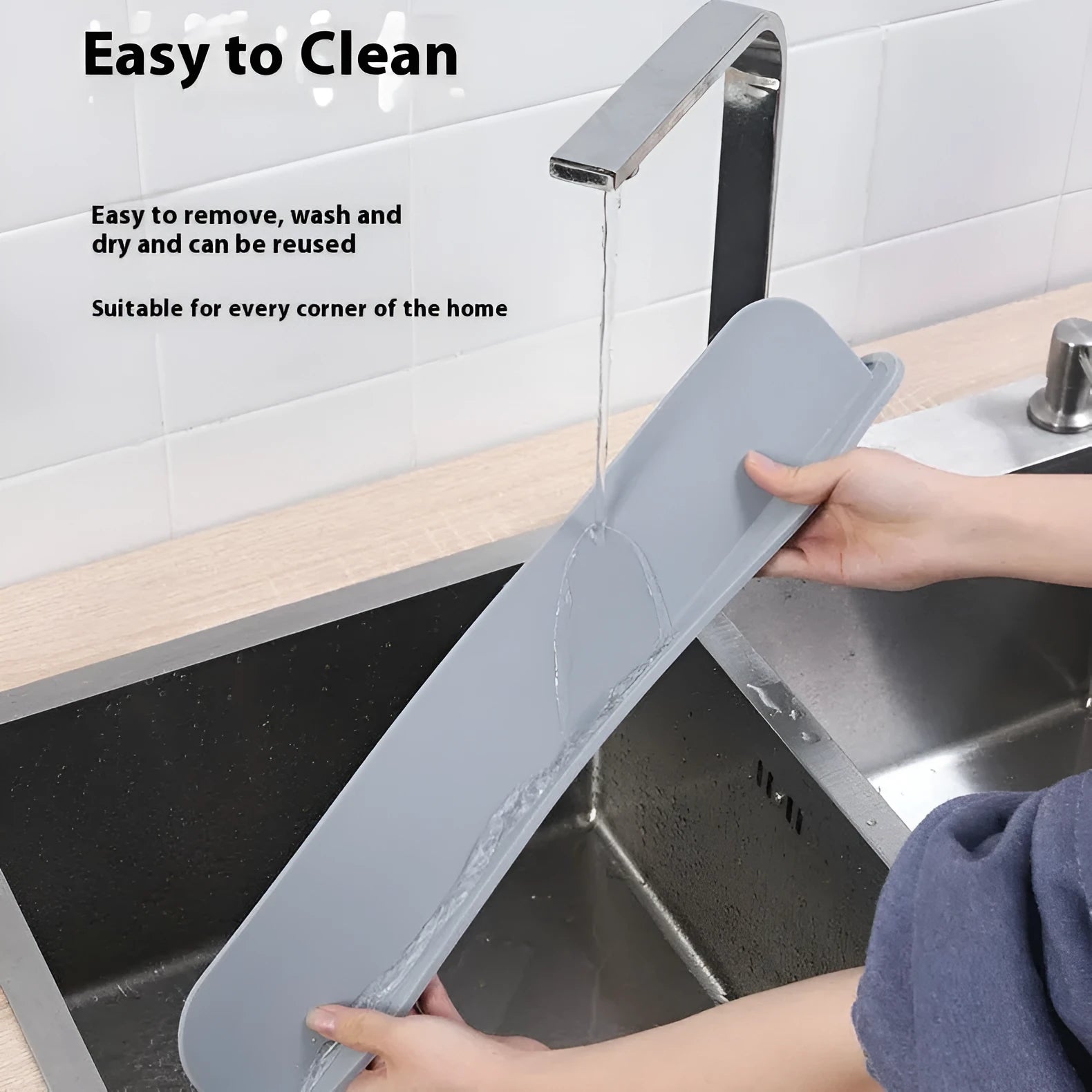 Grey silicone kitchen sink water blocking plate showing dimensions on a countertop.