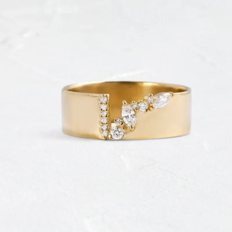 Gold electroplated women's ring with a shining zircon stone on a copper band.