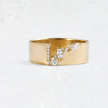 Gold electroplated women's ring with a shining zircon stone on a copper band.