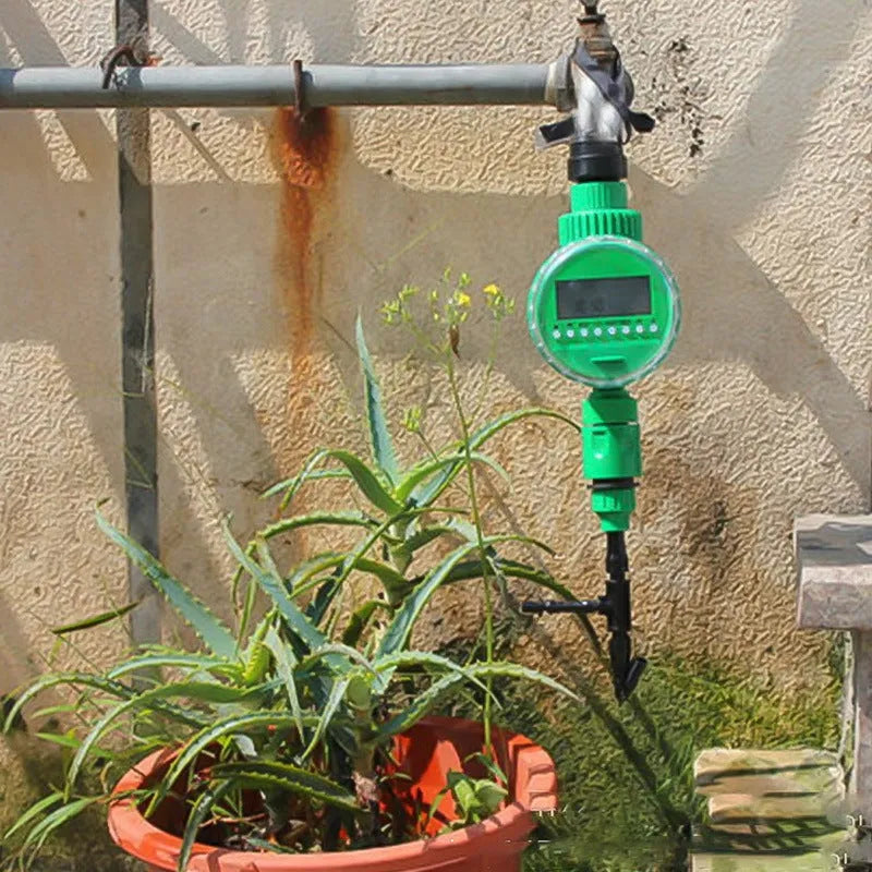 Automatic watering timer in green for drip irrigation with dial interface and brass connectors