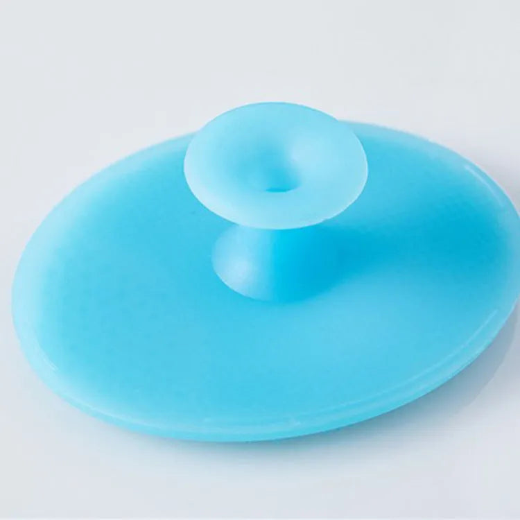 Silicone facial brush with three bristle types: tiny, middle, coarse; blue colour; 53mm size; for face cleansing and massage.