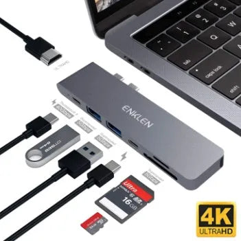 Silver aluminum Type C adapter with SD slot, HDMI port, and USB ports on a white background