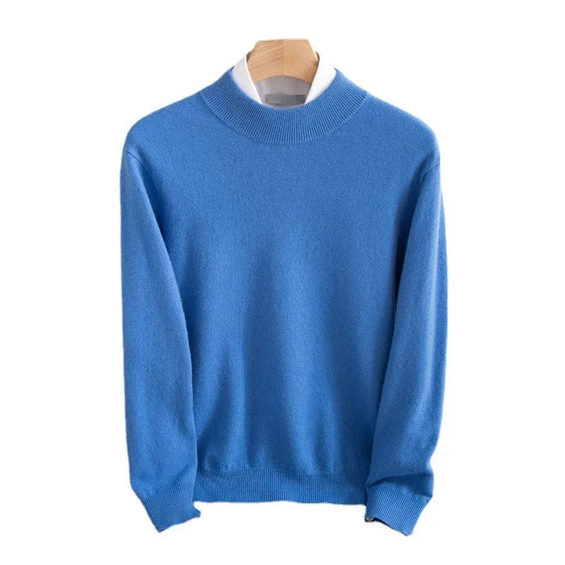 Man wearing a loose-fit half-turtleneck wool sweater in a neutral colour.