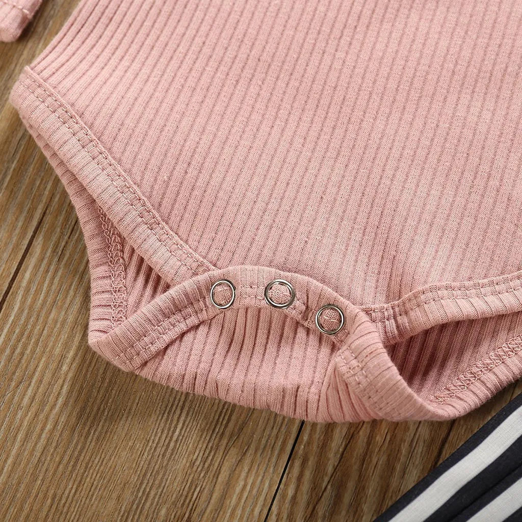 Women's pink cotton long sleeve top with size chart showing bust, length, waist measurements in centimetres