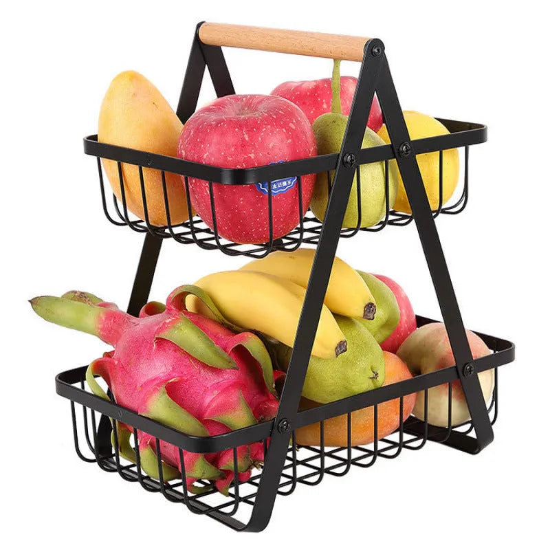 Detachable iron double-layer fruit basket with wooden handle on a kitchen table, black finish