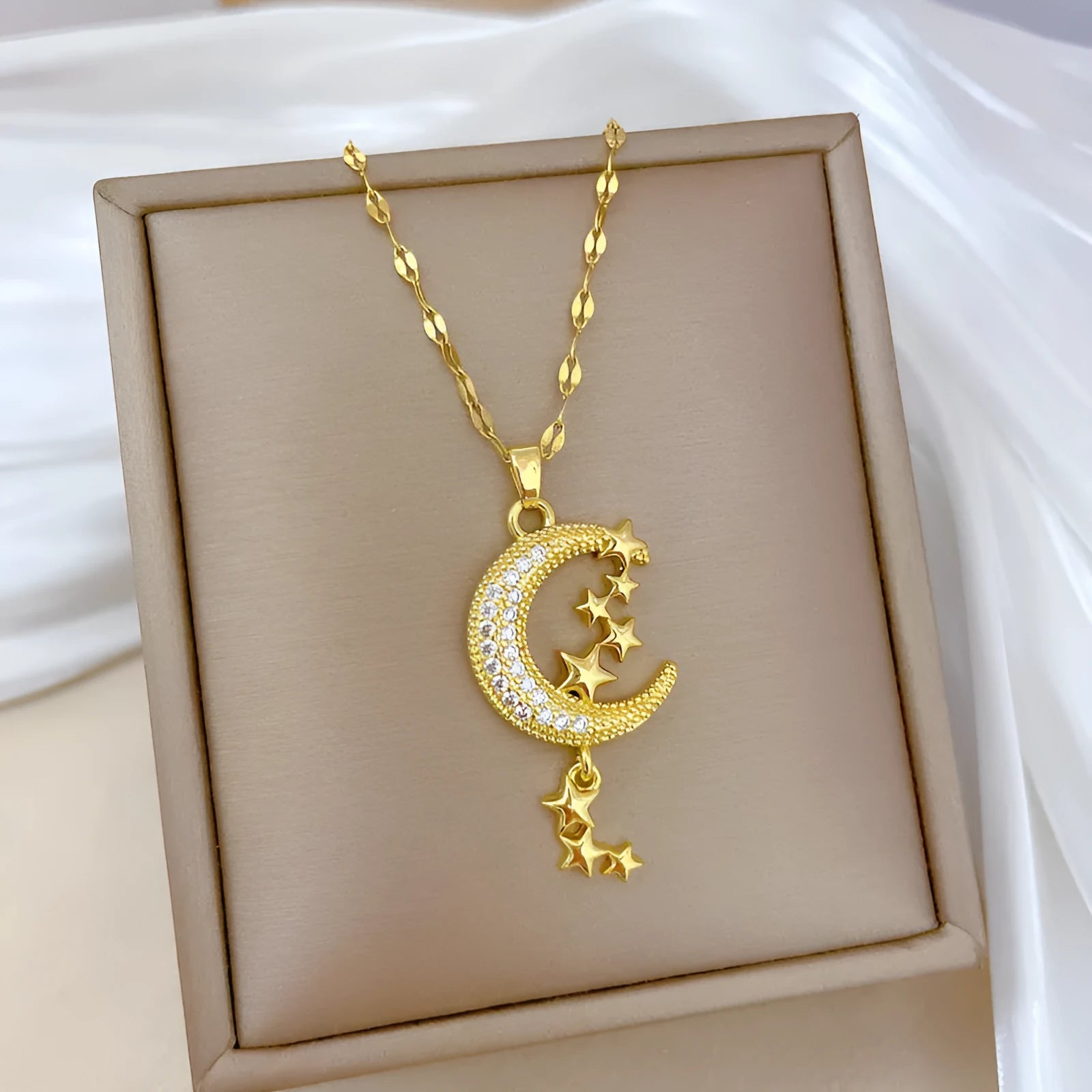 Stainless steel necklace with moon pendant and geometric tassel elements