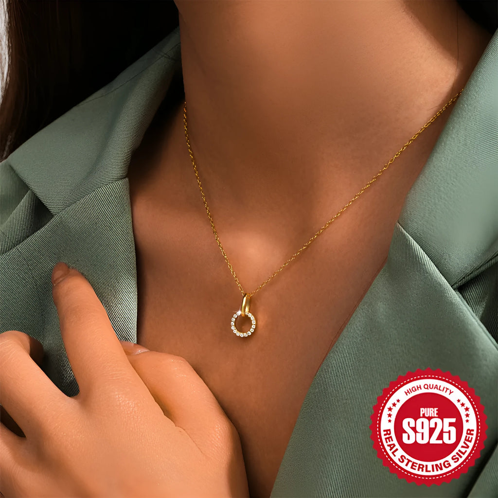 Gold tone S925 sterling silver adjustable clavicle chain necklace with a geometric interlocking zircon pendant.