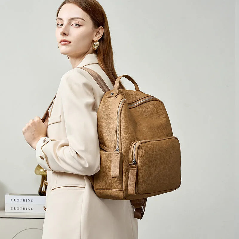 Genuine first layer cowhide backpack in square vertical shape with soft handle, available in multiple colours and sizes