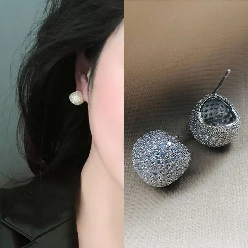 Women's geometric drop-shaped gold earrings with full diamond little golden beans design and spherical elements