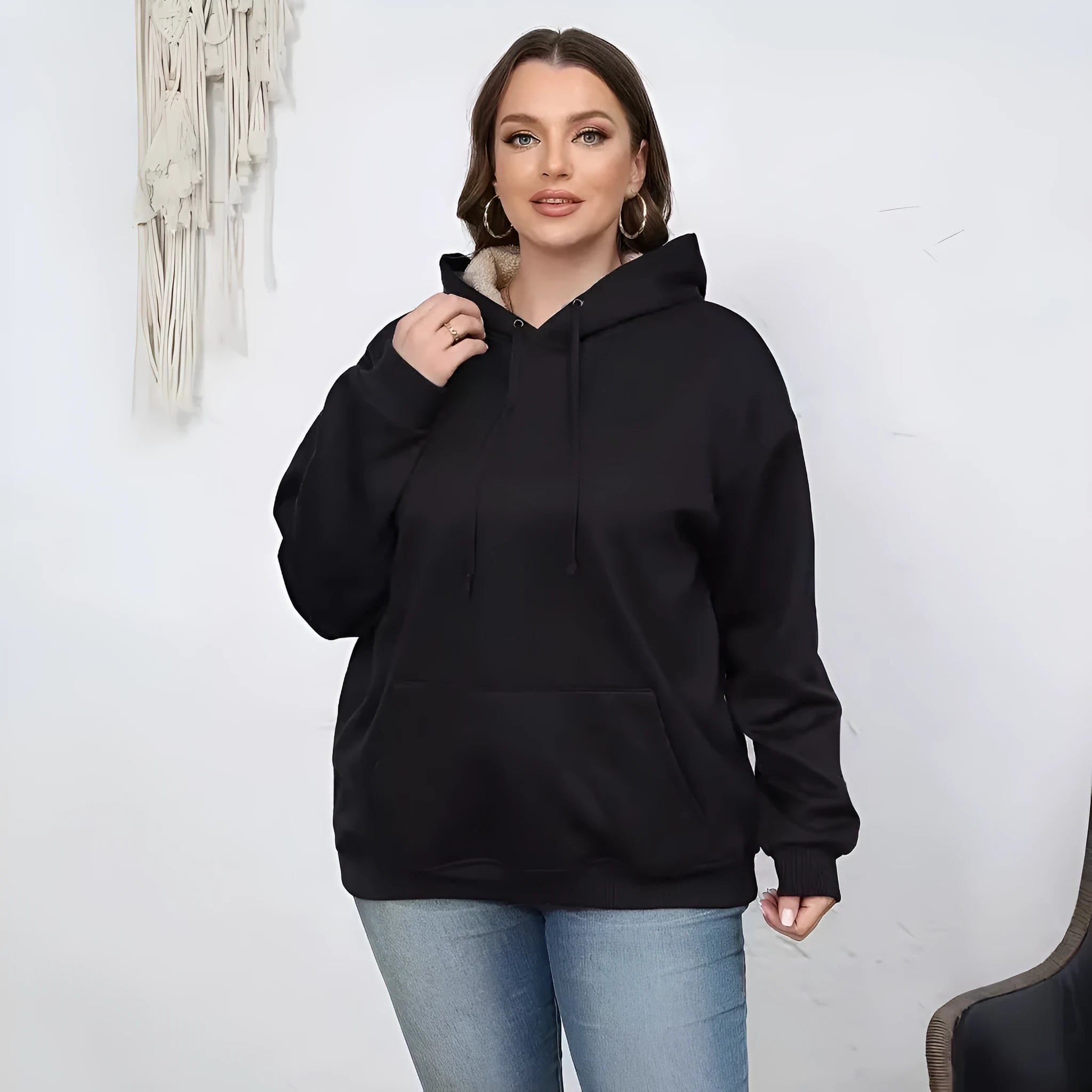 Women's loose fit grey hooded sweater with 3D raised pattern and front pocket