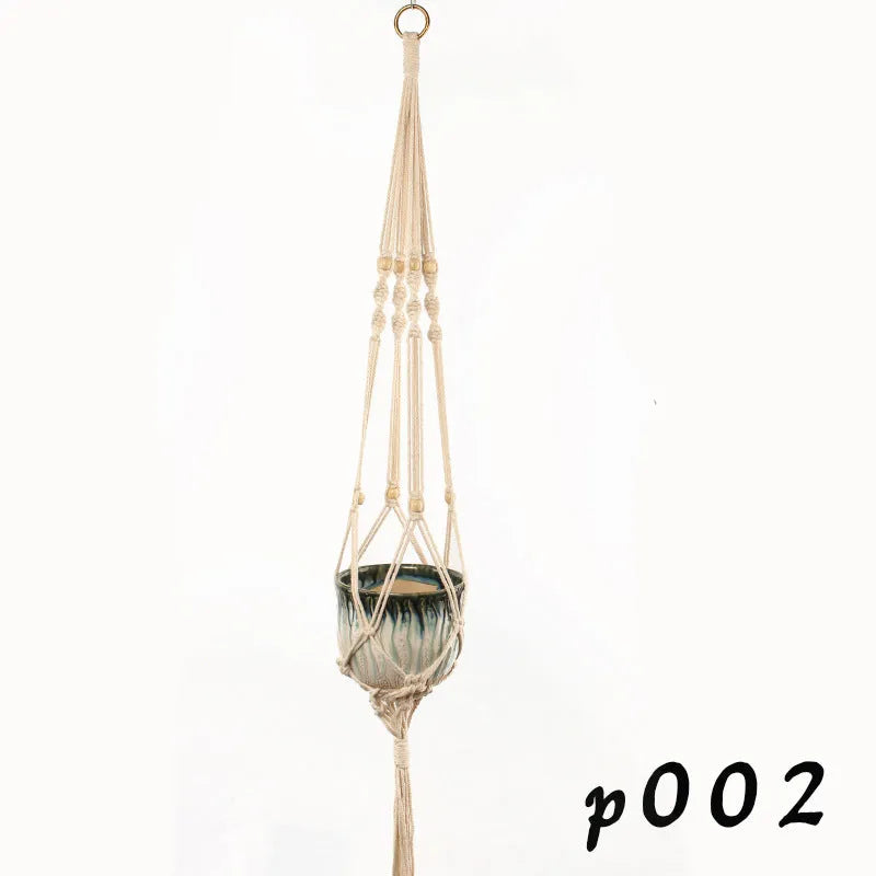 Woven cotton rope plant hanger in a hanging configuration holding a potted plant.