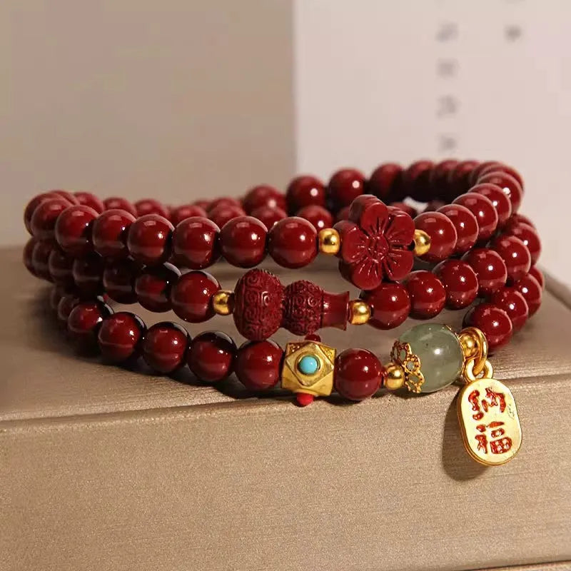 Polished cinnabar gourd five petal flower bracelet 6mm multi-circle on display