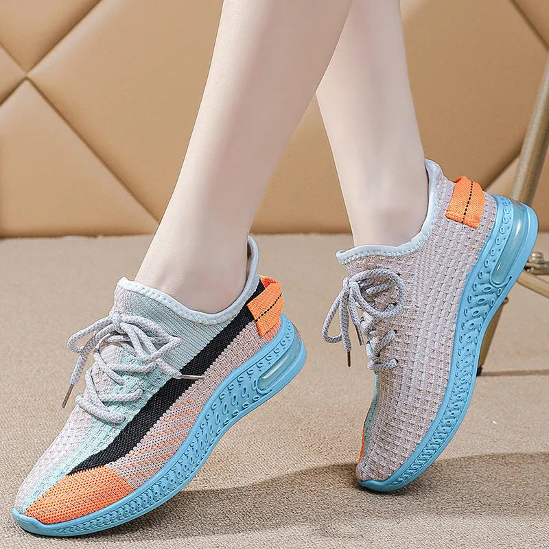 Women's lightweight breathable lace-up running shoes in black with round toe and low top profile