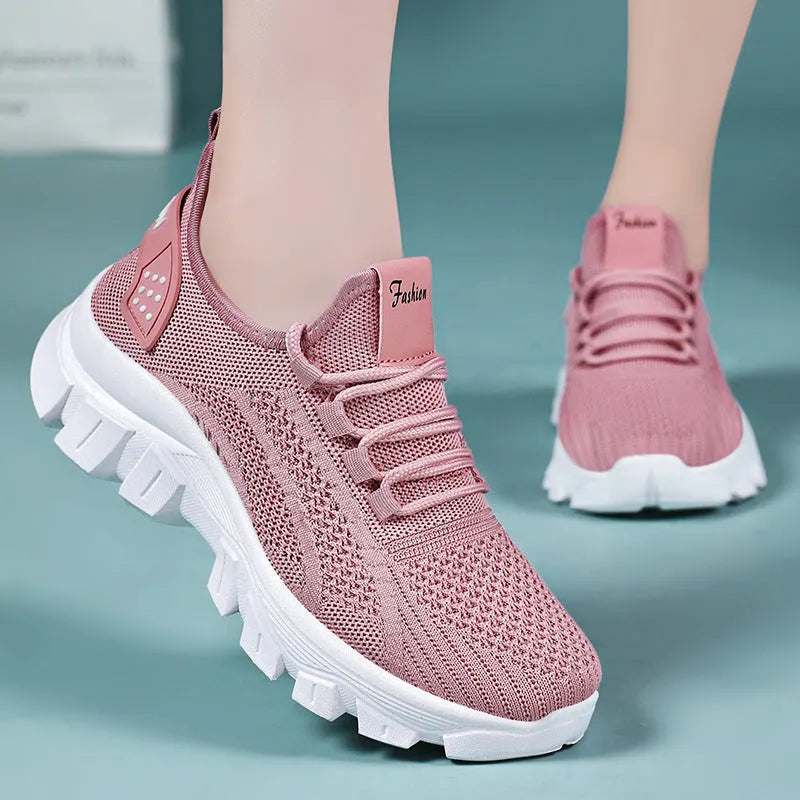 Men's white Flyknit running shoes with thick PVC sole and lace-up front.