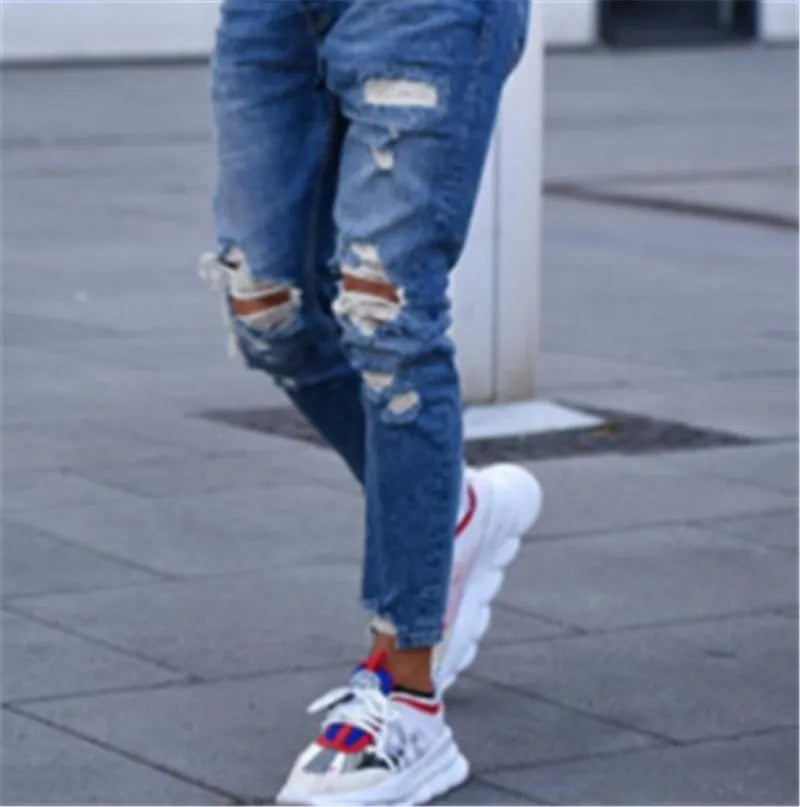 Men's deep blue cotton jeans with hole detailing showing front and back views