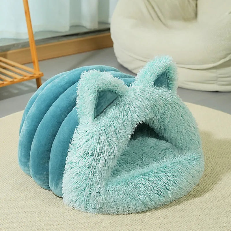 Plush cat and dog bed with raised collar and cat ear decoration in blue, size M