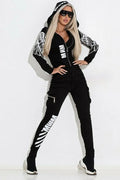 Black women's casual suit with wings print, featuring hooded zipper jacket and matching trousers