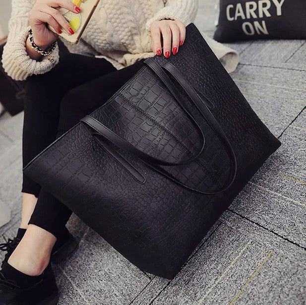A simple fashion shoulder bag and handbag for spring summer, shown in black and grey colour options.
