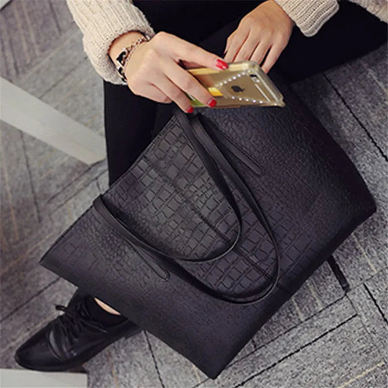 A simple fashion shoulder bag and handbag for spring summer, shown in black and grey colour options.
