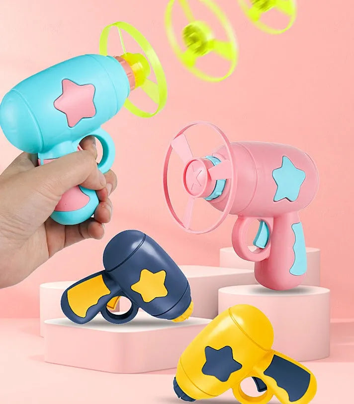 Flying saucer launcher toy with three blue flashing LED discs and target board on blister card