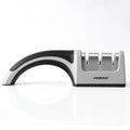 4-in-1 kitchen knife sharpener with multiple slots, black and cyan plastic and stainless steel body on a countertop