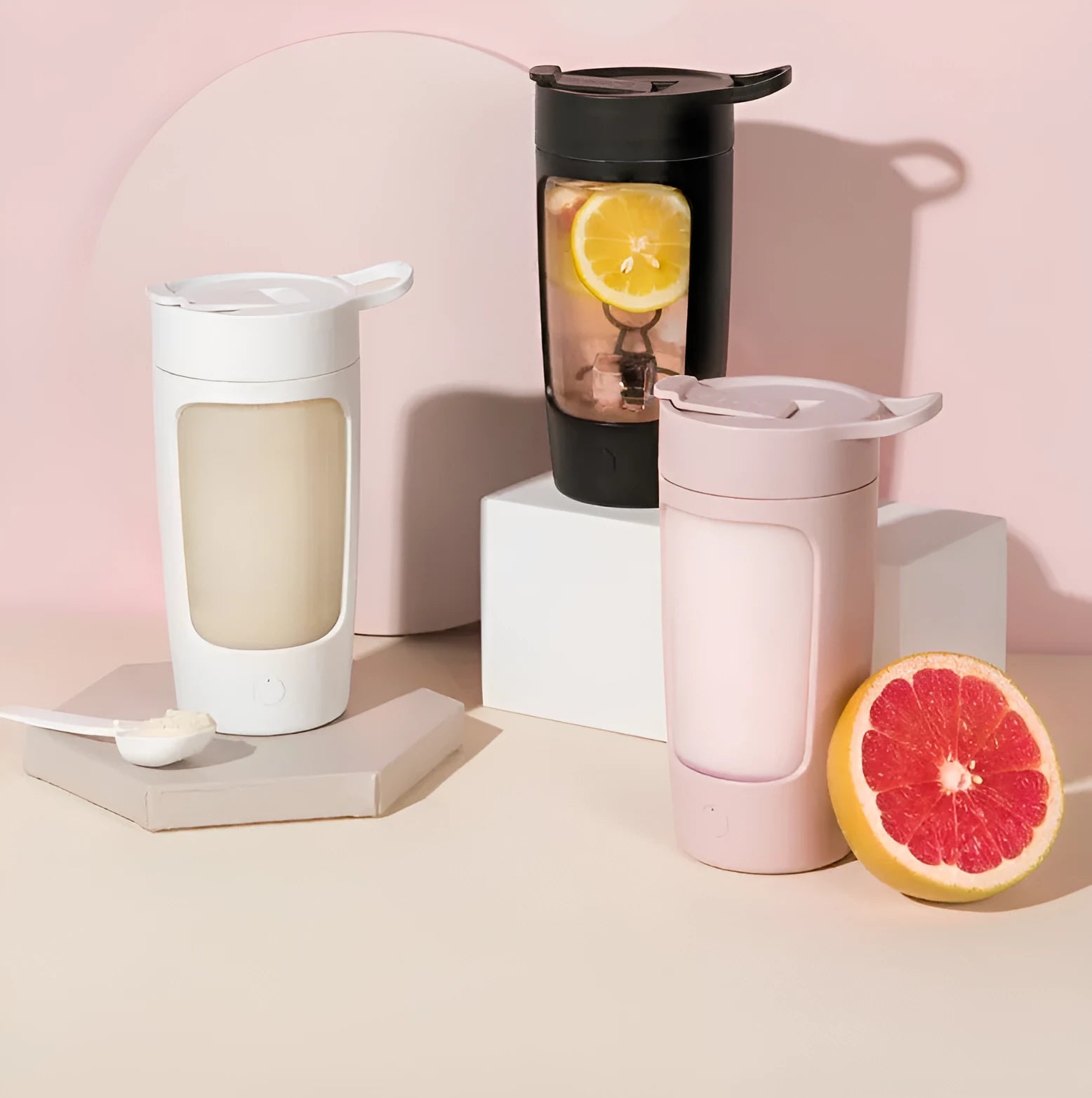 Portable automatic juice blender in black, blue, pink, or white colours showing 650ml capacity markings