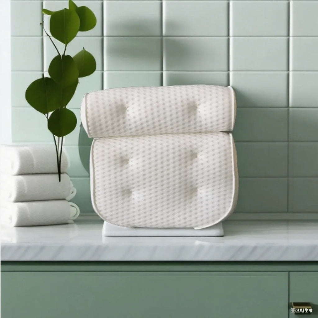 White bathtub pillow with mesh fabric and suction cups on a bathtub edge.