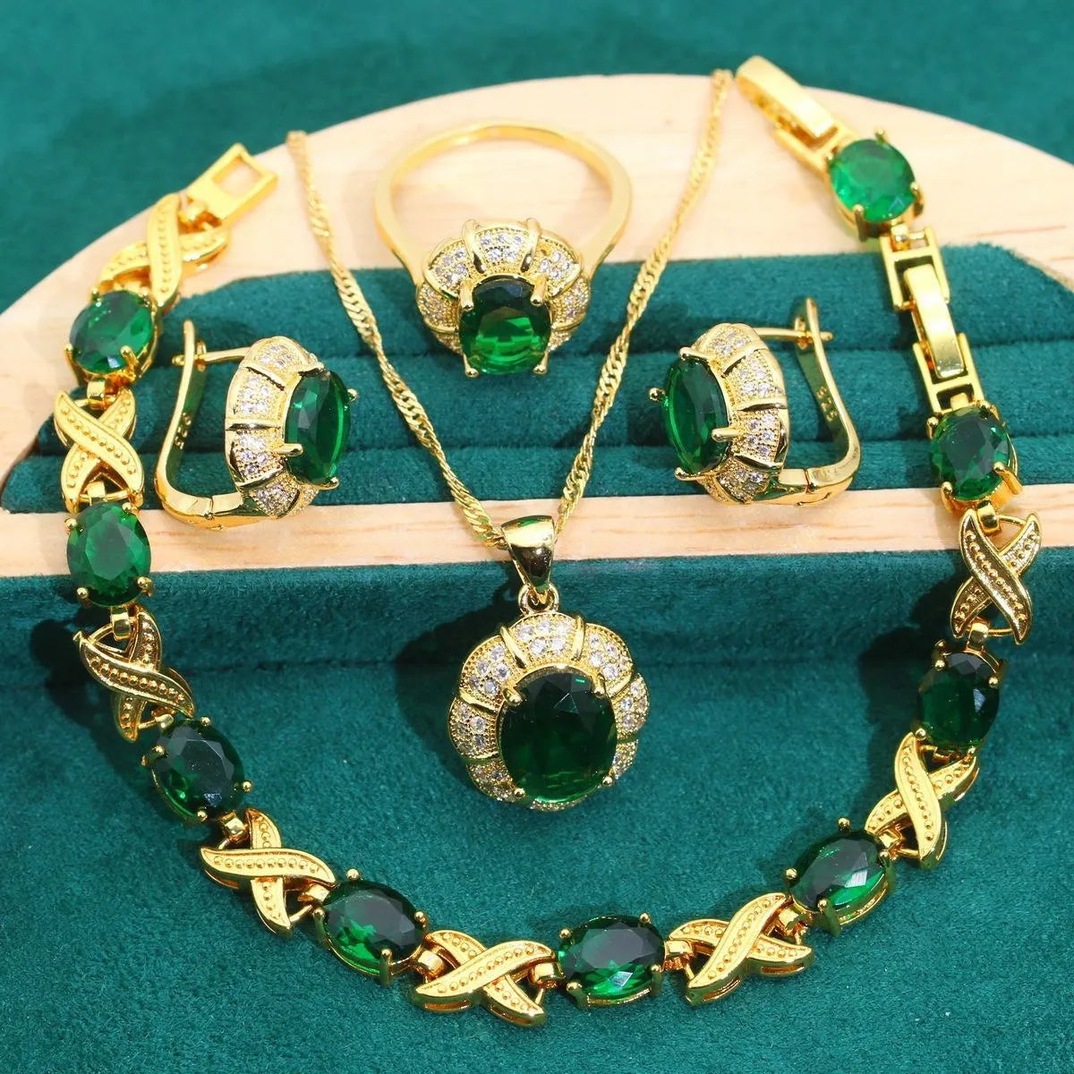 Four piece 18K gold plated jewellery set with coloured cubic zirconia stones including necklace earrings ring and bracelet