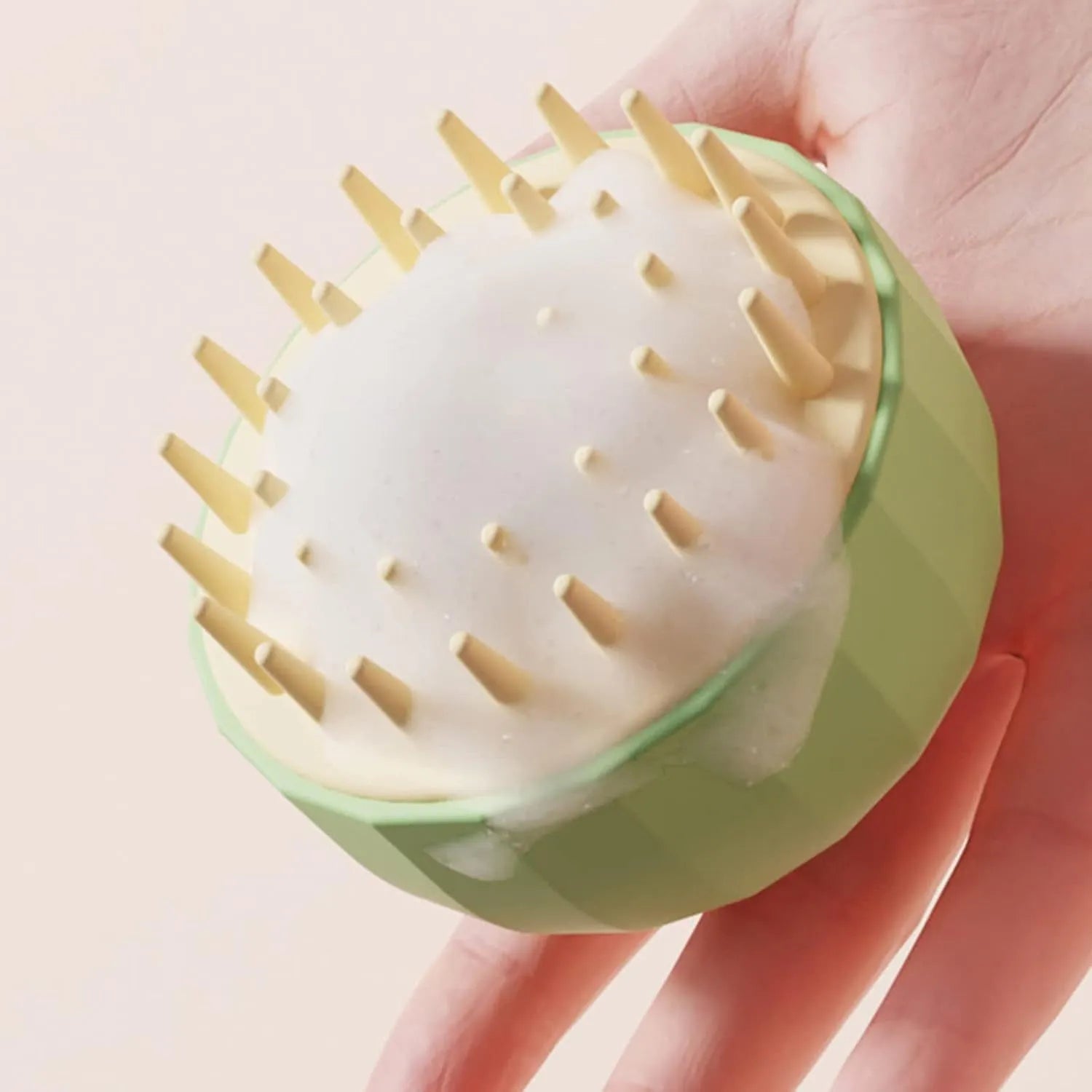 Green pet bath brush with silicone bristles and drain holes for dog and cat washing