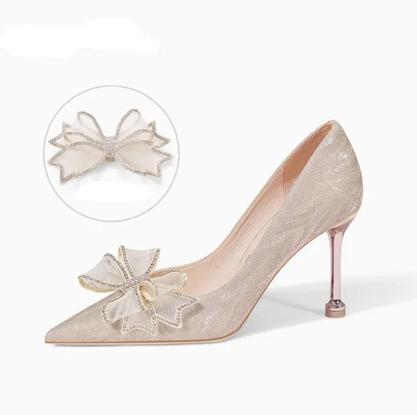 Champagne sequined women's stiletto pump with pointed toe and a high heel on a rubber sole.