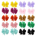 Grosgrain ribbon pinwheel hair bow 3 inches with alligator clip on light background