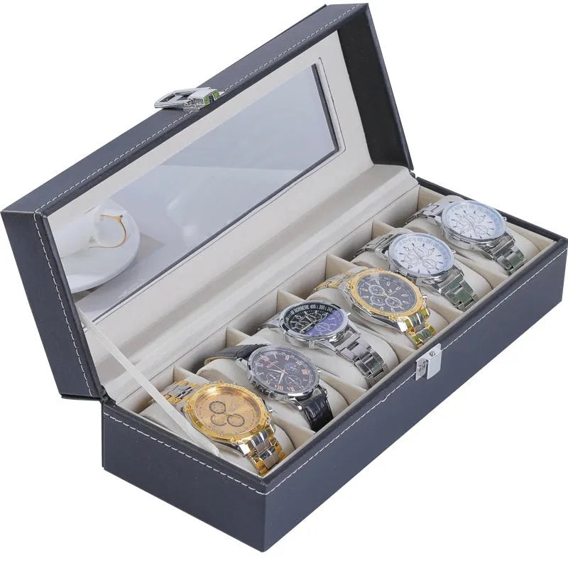 Grey leather watch storage box with clear dustproof lid showing interior watch compartments