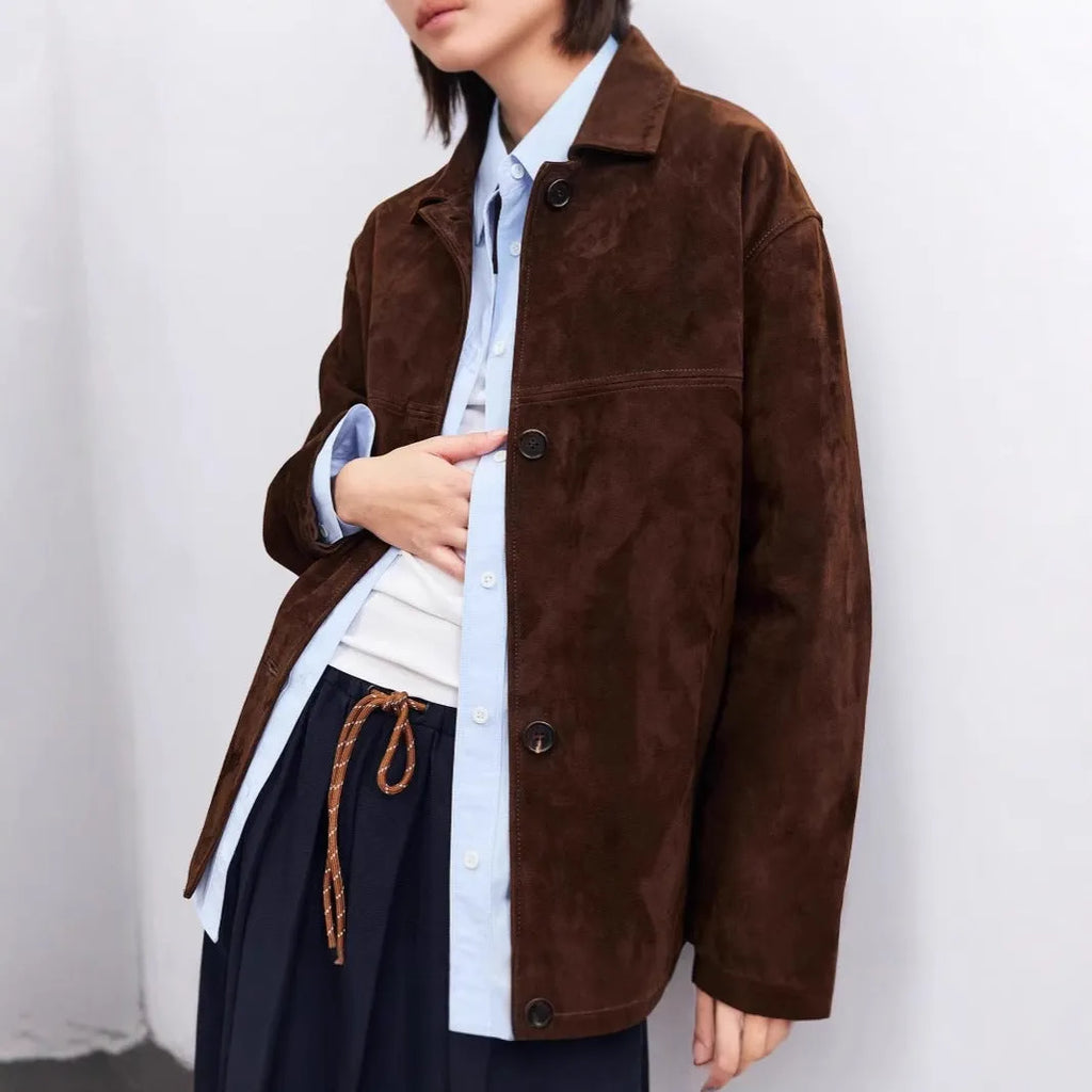 Brown cashmere coat with Peter Pan collar and leather stitching in retro art style