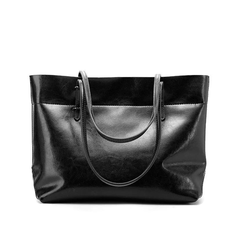 Brown waxed cowhide leather crossbody handbag shown horizontally, displaying two main compartments and a front phone pocket.