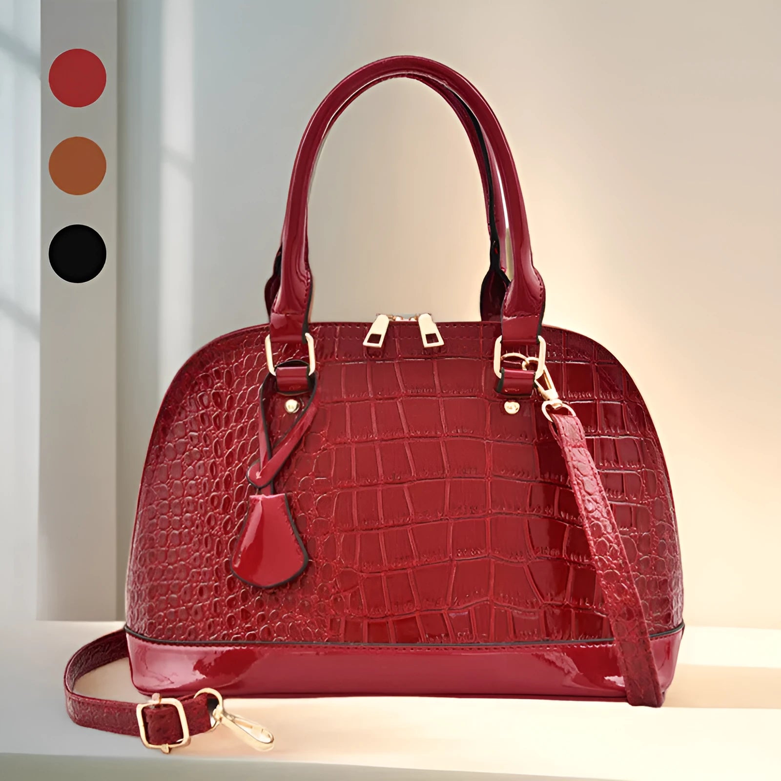 Large shell-shaped shoulder crossbody bag in shiny PU leather with structured silhouette