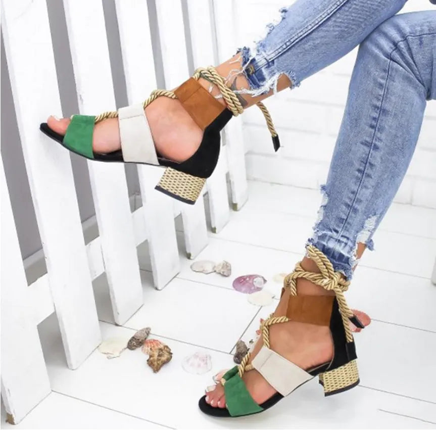 Women's suede ankle-strap sandals with thick round head and colour-matched design on a white background