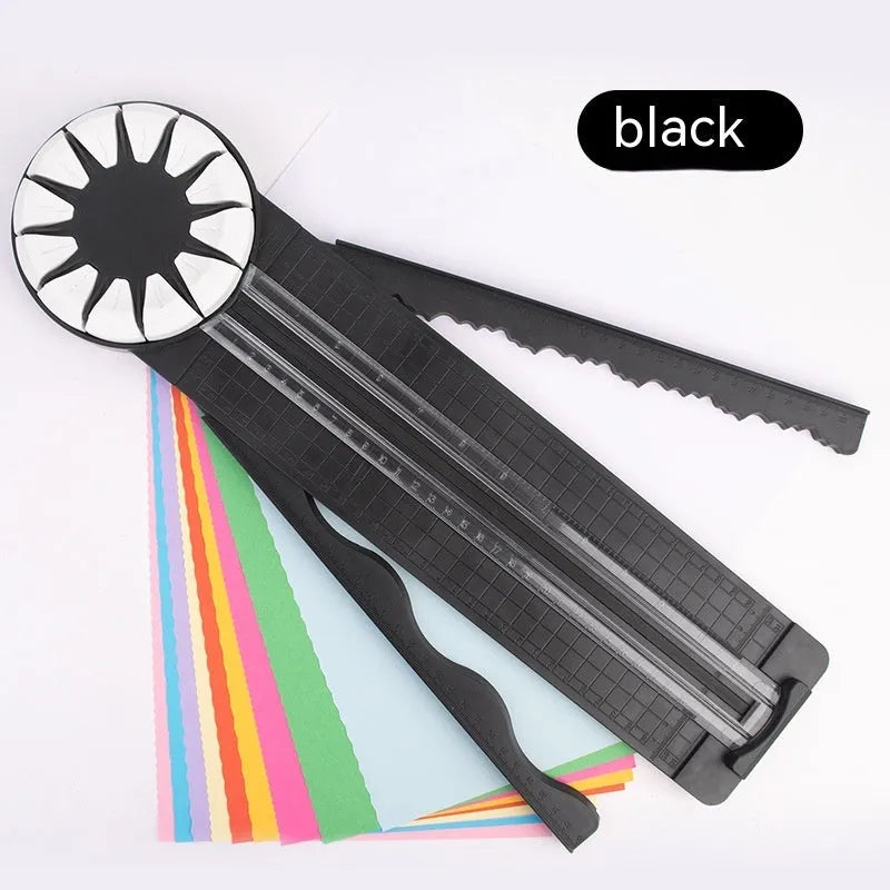 Pink and black 12-in-1 dotted plastic paper cutting machine on a white background.