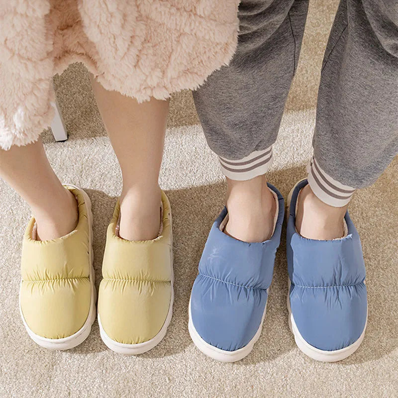 Blue winter house slippers with artificial leather upper, thick rubber sole, and plush lining.