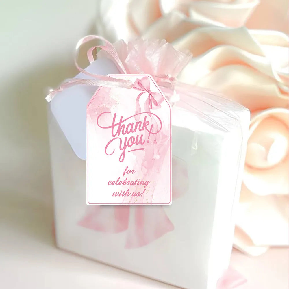 Bowknot-shaped paper gift tags with natural hemp rope ties for birthday party decoration