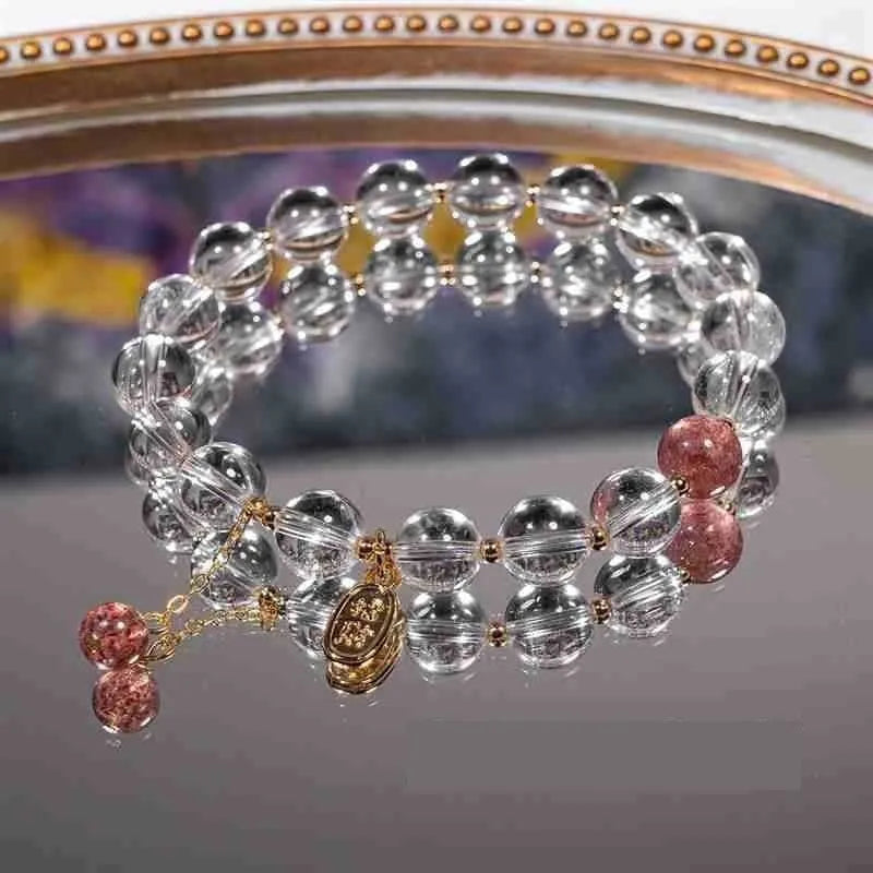 Natural white crystal lucky fortune bracelet on display with beads arranged in a U-shape on a neutral background.