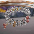 Natural white crystal lucky fortune bracelet on display with beads arranged in a U-shape on a neutral background.